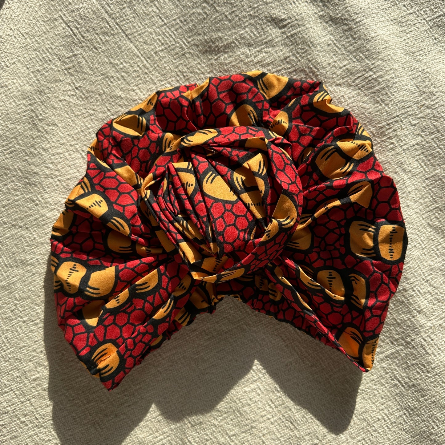 Satin gefütterter Turban rot gelb